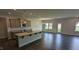 Modern kitchen with an island, granite countertops, and stainless steel appliances at 622 Ravensworth Dr, Garner, NC 27529