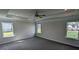 Large main bedroom features a ceiling fan, tray ceiling, and lots of natural light at 622 Ravensworth Dr, Garner, NC 27529