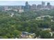 Aerial view of a neighborhood with mature trees showcasing a blend of urban and natural settings at 628 Bragg St, Raleigh, NC 27610