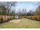Spacious fenced backyard with a storage shed is perfect for outdoor activities and relaxation at 628 Bragg St, Raleigh, NC 27610