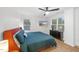 Bedroom featuring natural light, a ceiling fan, and hardwood floors at 628 Bragg St, Raleigh, NC 27610