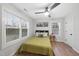 Inviting bedroom with a comfy bed, plenty of natural light from two windows, and hardwood floors at 628 Bragg St, Raleigh, NC 27610