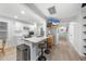 Modern kitchen with white cabinets, a breakfast bar, and stainless-steel appliances at 628 Bragg St, Raleigh, NC 27610