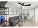 Inviting living room featuring modern furniture, a ceiling fan, and a large window at 628 Bragg St, Raleigh, NC 27610