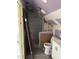 Bathroom under construction with new tiles in shower and new toilet at 728 East Ave, Henderson, NC 27536