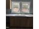 Bright kitchen featuring modern countertops, stainless steel faucet, and natural light at 728 East Ave, Henderson, NC 27536