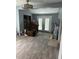 Living room in need of remodeling with new flooring and an abundance of natural light at 728 East Ave, Henderson, NC 27536