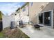 Back patio with privacy fence features an outdoor seating area with rocking chairs and a fire pit at 7832 Allscott Way, Raleigh, NC 27612