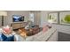 Inviting living room with a large sofa, wooden coffee table, and modern decor at 86 Saddle Mare St, Clayton, NC 27520