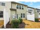 A cozy backyard view with green bushes and a white fence, creating a private outdoor space at 94 E Grove Point Dr, Clayton, NC 27527