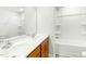 A well-lit bathroom featuring a tub/shower combo and a double sink with a big mirror at 94 E Grove Point Dr, Clayton, NC 27527