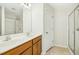 Bathroom with double vanity, wood cabinets, and glass-enclosed shower at 94 E Grove Point Dr, Clayton, NC 27527