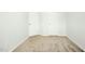 Bedroom with neutral carpet and two doors for closet and bathroom access at 94 E Grove Point Dr, Clayton, NC 27527
