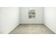 Small bedroom with carpet flooring, and a single window for natural light at 94 E Grove Point Dr, Clayton, NC 27527