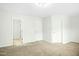 Bedroom with neutral carpet and multiple doors for closet and bathroom access at 94 E Grove Point Dr, Clayton, NC 27527