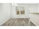 Bright dining room featuring hardwood floors, a chandelier and a window at 94 E Grove Point Dr, Clayton, NC 27527