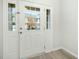 A bright entryway door with sidelights lets in natural light and offers a clear view of the exterior at 94 E Grove Point Dr, Clayton, NC 27527