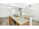 Kitchen island with a double sink, dishwasher, and light granite countertops at 94 E Grove Point Dr, Clayton, NC 27527
