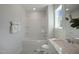 Bright bathroom features tub and shower combination, quartz vanity with ample natural light at 35 Merle Dr, Wendell, NC 27591