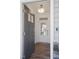 Open foyer view with wood floors, showcasing the front door with glass and lighting at 35 Merle Dr, Wendell, NC 27591