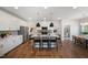 Spacious kitchen featuring a large island, stainless steel appliances, and modern pendant lighting at 35 Merle Dr, Wendell, NC 27591