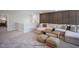 Spacious living room with a comfortable sectional sofa, a rustic coffee table, and plenty of natural light at 35 Merle Dr, Wendell, NC 27591