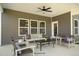 Inviting covered patio with comfortable seating and ceiling fan at 35 Merle Dr, Wendell, NC 27591