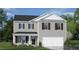 Charming two-story home with gray siding, black shutters, and a two-car garage at 100 Tobacco Woods Dr, Youngsville, NC 27596