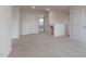 Upstairs hallway with neutral carpet and a view into a room at 100 Tobacco Woods Dr, Youngsville, NC 27596