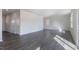 Expansive living room featuring hardwood floors and natural light from well-placed windows at 100 Tobacco Woods Dr, Youngsville, NC 27596