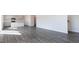 Open-concept living space featuring hardwood floors and seamless transitions to the kitchen and dining areas at 100 Tobacco Woods Dr, Youngsville, NC 27596