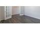 Spacious room featuring neutral walls, hard wood floors, and glass paneled doors at 100 Tobacco Woods Dr, Youngsville, NC 27596