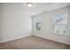 Bright bedroom with neutral carpeting and windows providing ample natural light at 1012 Bookmark Trl, Durham, NC 27703