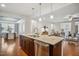 Open kitchen design flowing into dining and living areas, perfect for entertaining at 1012 Bookmark Trl, Durham, NC 27703