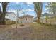 Expansive backyard with a circular firepit area, ideal for outdoor entertainment and enjoying nature at 1012 Holloway St, Durham, NC 27701