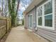 Backyard with a small storage shed and a concrete patio area outside the back door at 1012 Holloway St, Durham, NC 27701