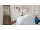Bedroom showcasing an ensuite bath and hallway access with stylish decor and soft, inviting textures at 1012 Holloway St, Durham, NC 27701