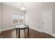 Dining room with hardwood floors, neutral paint, and classic lighting, ideal for Gathering meals and entertaining at 1012 Holloway St, Durham, NC 27701