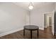 Dining room with hardwood floors, neutral paint, and classic lighting, ideal for Gathering meals and entertaining at 1012 Holloway St, Durham, NC 27701