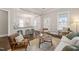 Open-concept living room with barstool seating at the kitchen counter at 1012 Holloway St, Durham, NC 27701
