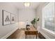Bright home office with a large window, wood-paneled accent wall, and a spacious desk at 1012 Holloway St, Durham, NC 27701
