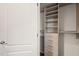 Well-organized walk-in closet provides ample storage with custom shelving and drawer units at 1012 Holloway St, Durham, NC 27701
