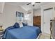 Comfortable bedroom featuring a plush blue bed, dresser, and ample closet space at 104 Piquot Drive, Louisburg, NC 27549