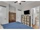 Comfortable bedroom with a large bed, dresser, and convenient storage at 104 Piquot Drive, Louisburg, NC 27549