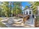 Charming home featuring a spacious deck and a convenient ramp for accessibility at 104 Piquot Drive, Louisburg, NC 27549
