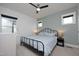 Inviting bedroom featuring a metal bed frame, soothing wall color, and ample natural light at 106 Cottage Way # 33, Pittsboro, NC 27312
