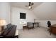 Cozy bedroom with sloping ceilings, carpet, black blind, and ceiling fan at 106 Cottage Way # 33, Pittsboro, NC 27312