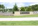 View of the Knight Farm community park sign with playground and manicured landscaping at 106 Cottage Way # 33, Pittsboro, NC 27312