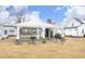 Community pavilion with a stone fireplace and grill, surrounded by a grassy lawn and houses at 106 Cottage Way # 33, Pittsboro, NC 27312