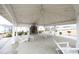 Under the community pavilion, featuring a stone fireplace, grills, tables, and chairs for residents at 106 Cottage Way # 33, Pittsboro, NC 27312